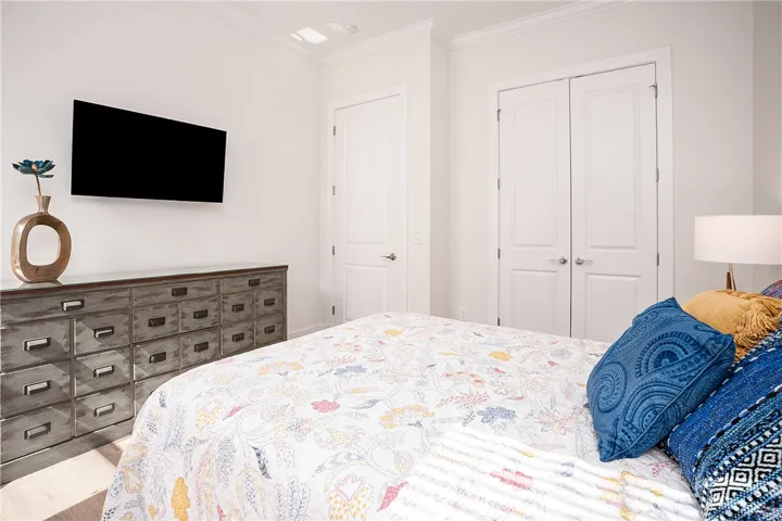 Clean lines and a spacious layout define this comfortable bedroom sanctuary.