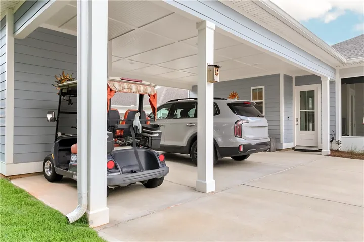 Secure covered parking with ample space for vehicles and recreational equipment.