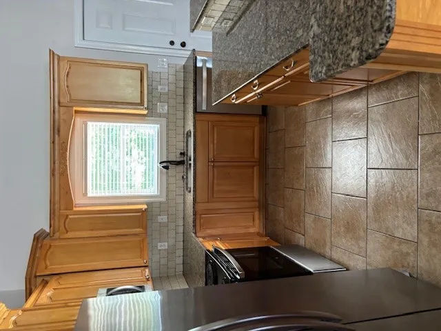 A well-appointed culinary space featuring extensive cabinetry and essential appliances.