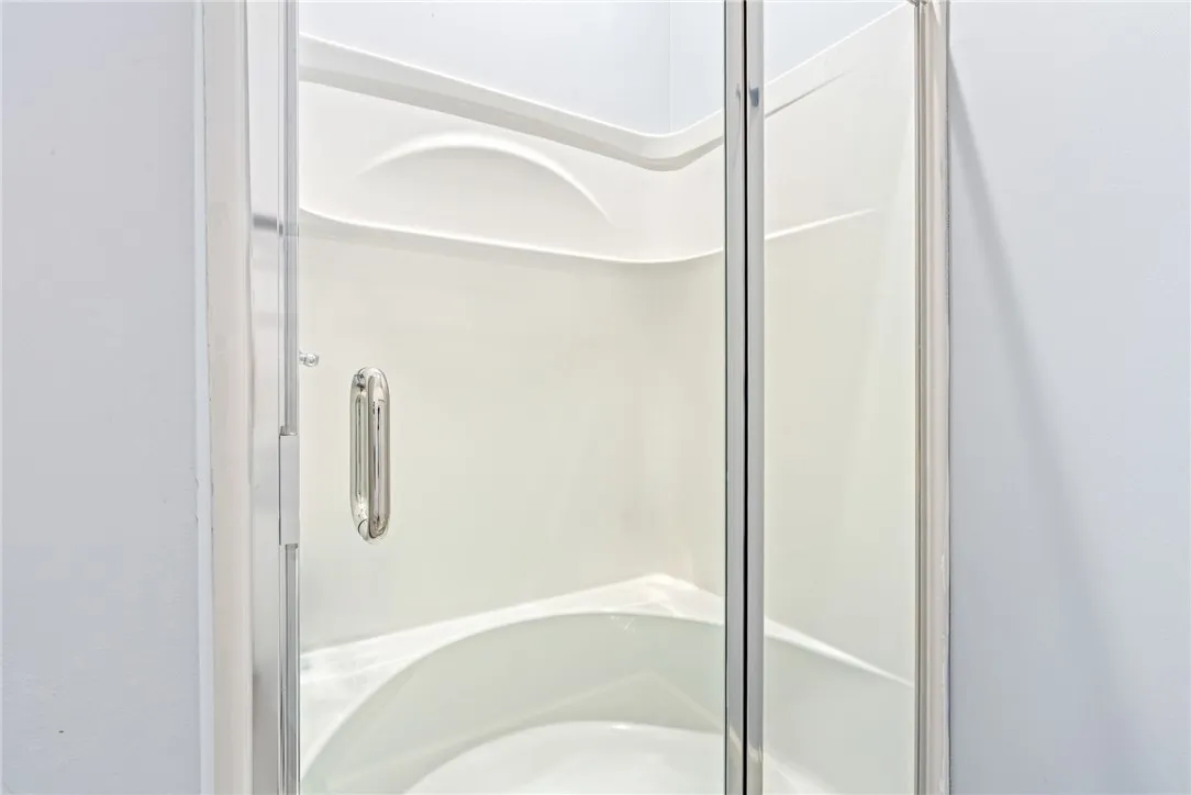A pristine shower stall offers a refreshing start to your day.