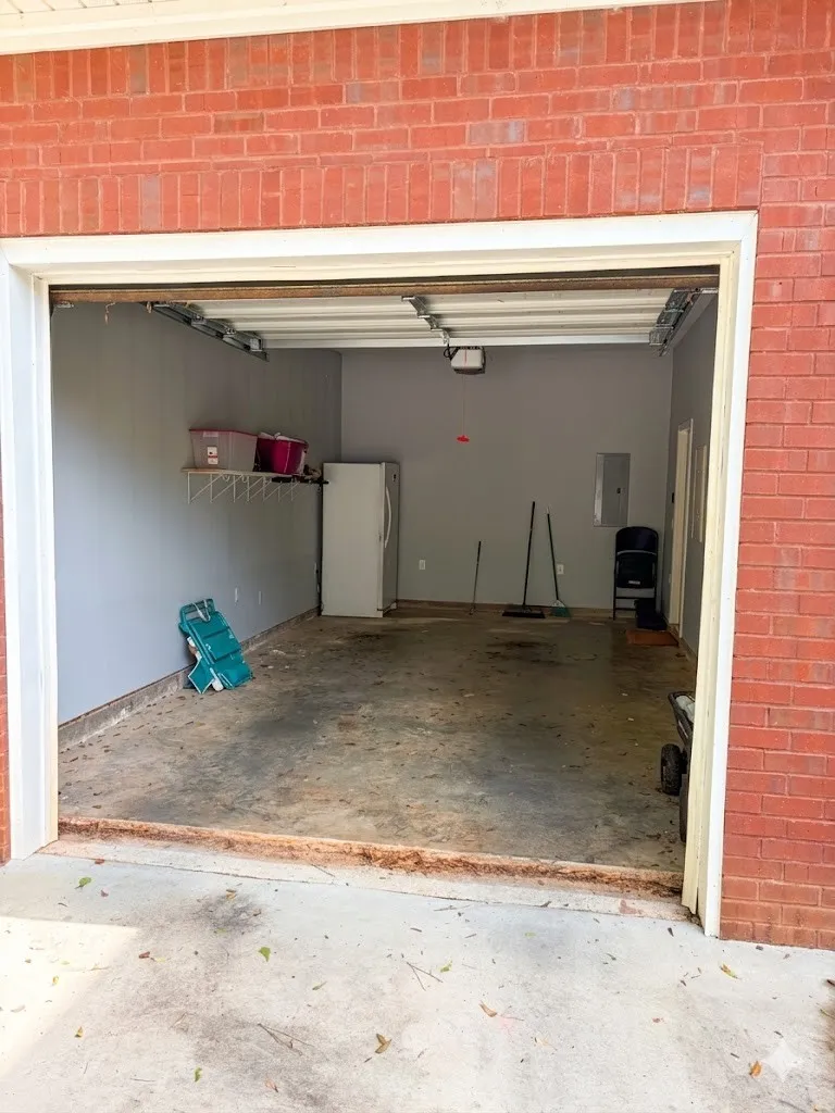 Secure parking or ample storage space within this brick-faced garage.