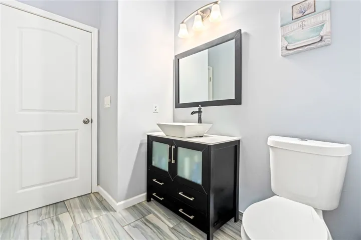 A well-appointed bathroom with a modern vanity and clean, sleek fixtures.