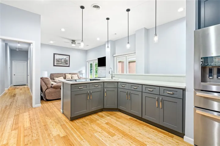 A well-appointed kitchen seamlessly flows into the living area, offering modern cabinetry and fixtures.