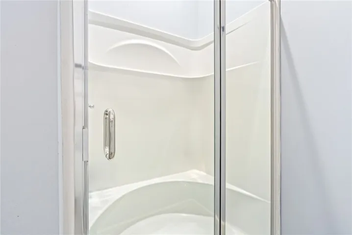 A pristine shower stall offers a refreshing start to your day.