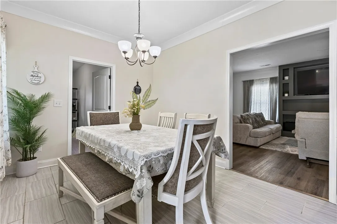 Elegant dining space, ideal for hosting memorable gatherings, connects seamlessly to the living area.