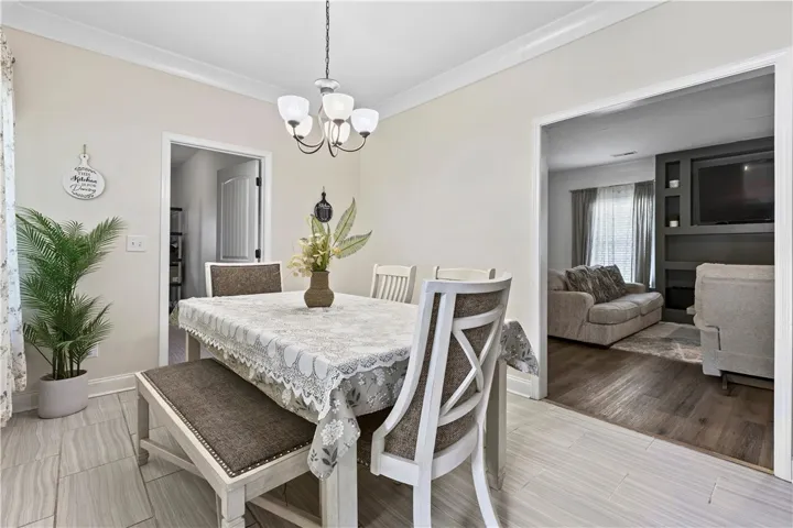 Elegant dining space, ideal for hosting memorable gatherings, connects seamlessly to the living area.