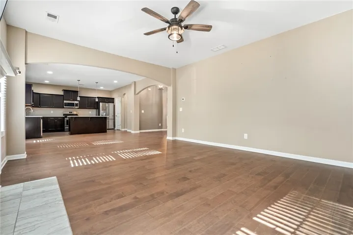 An inviting open-concept layout connects the well-appointed kitchen with abundant living space.