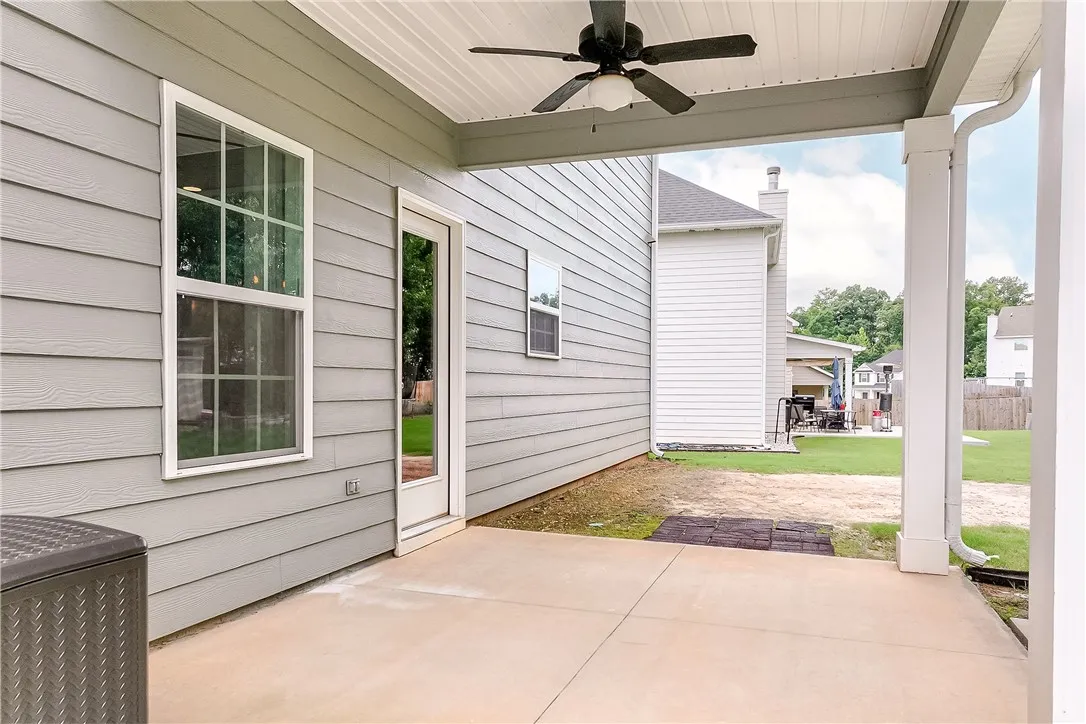 A well-lit patio area provides a seamless transition to the spacious outdoor living.