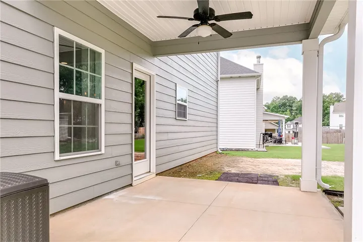 A well-lit patio area provides a seamless transition to the spacious outdoor living.