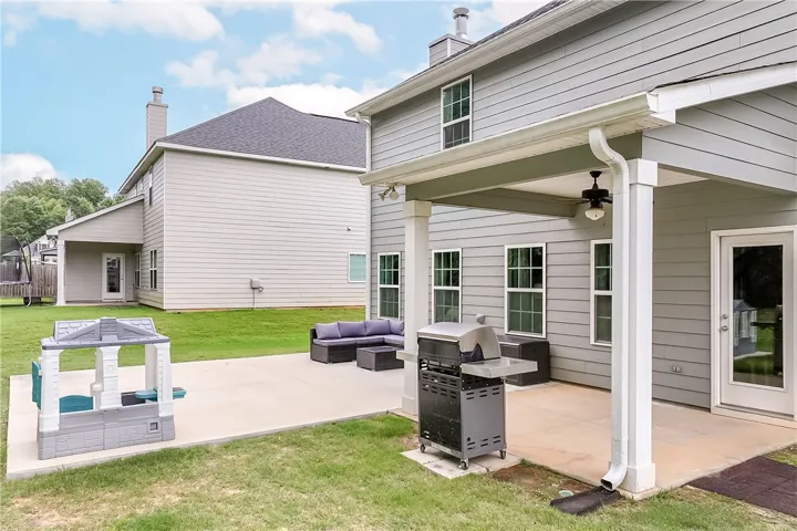 An inviting backyard patio provides an ideal setting for outdoor gatherings and relaxation.