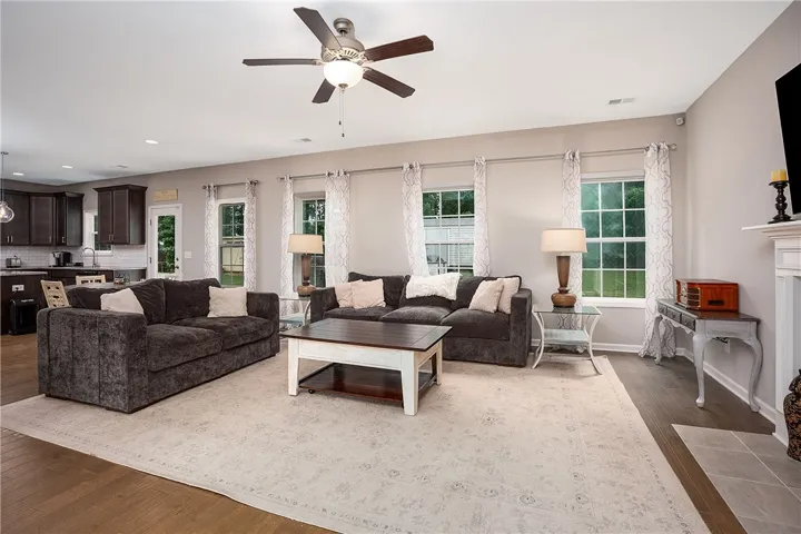 An open concept floorplan effortlessly links the comfortable living area to the well-appointed kitchen.