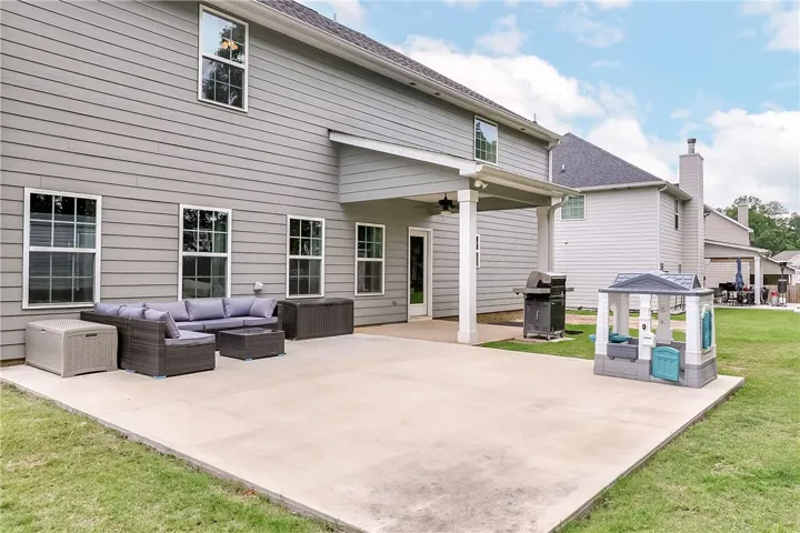 A spacious backyard patio provides ample room for leisure and outdoor entertaining.