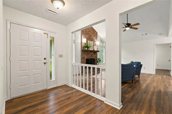 An inviting entry opens to a spacious living area.