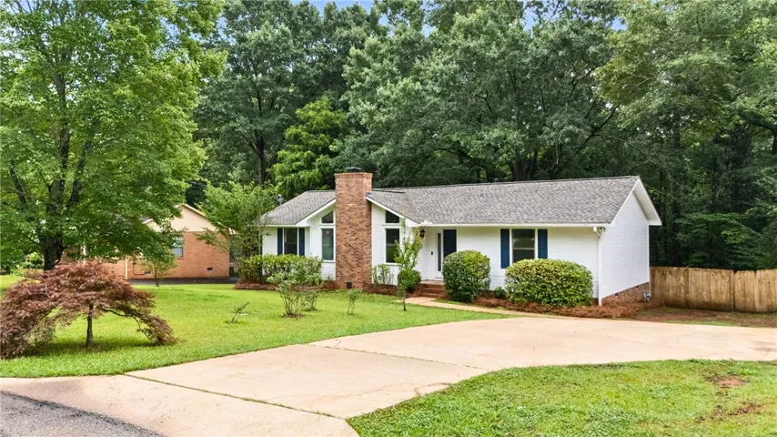 A well-maintained ranch home with mature vegetation - see details!