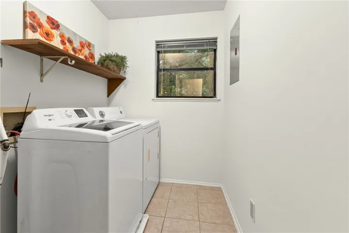 Full laundry room -complete with washer/dryer- and pantry/linen closet as well.
