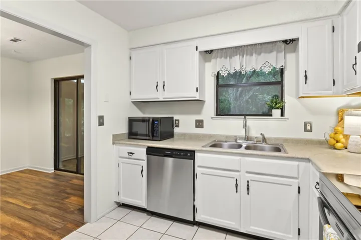 A well-lit kitchen with young appliances & attractive cabinetry!