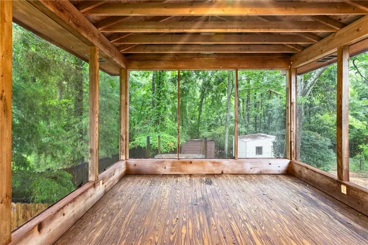 A tranquil screened porch  off the deck offers escape from southern bugs and great place to enjoy the outdoors.