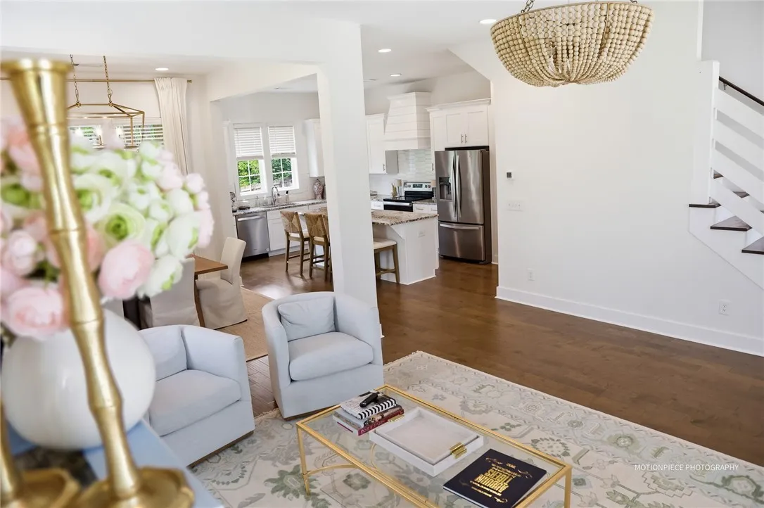 An open-concept living space connects seamlessly to a modern kitchen, creating an ideal area for gathering.