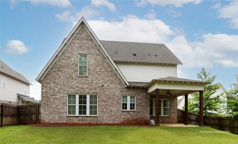 A classic brick exterior blends seamlessly with the outdoor patio, perfect for relaxing evenings.
