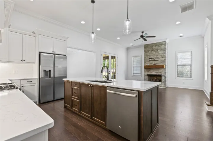 Culinary delights await in this modern kitchen with an expansive island and sophisticated finishes.