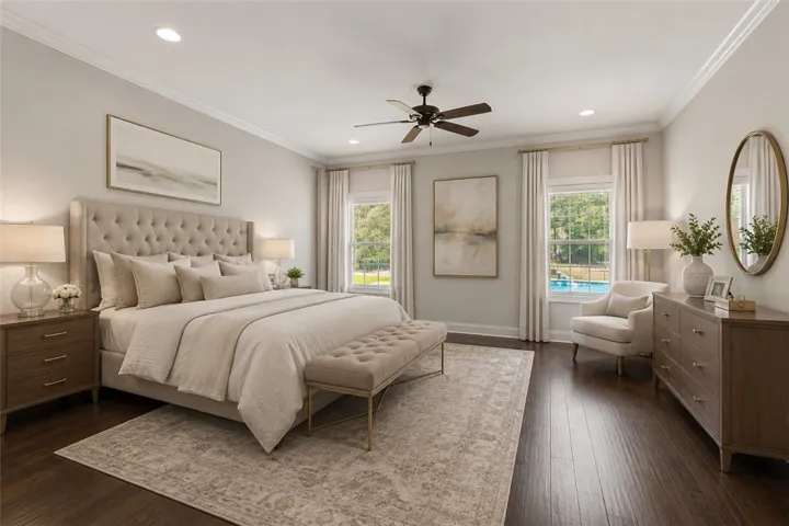 An inviting sleeping space with hardwood flooring and bright windows framing outdoor tranquility.