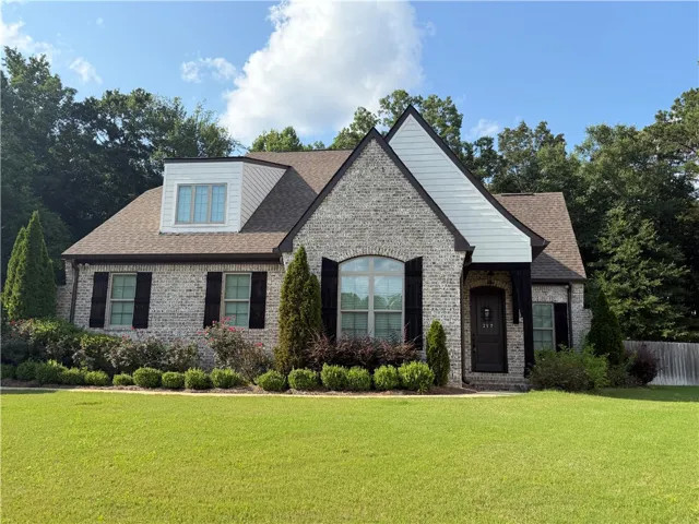 A welcoming home with a meticulously landscaped front yard.