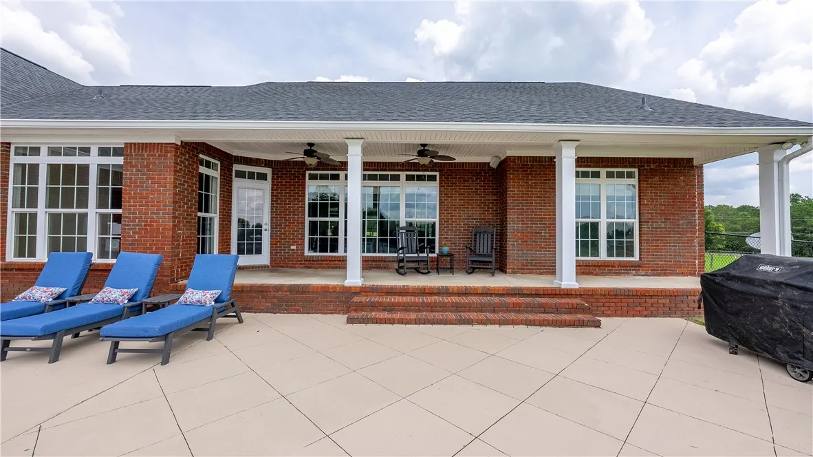 Brick exterior offers a spacious covered patio, perfect for outdoor entertaining.