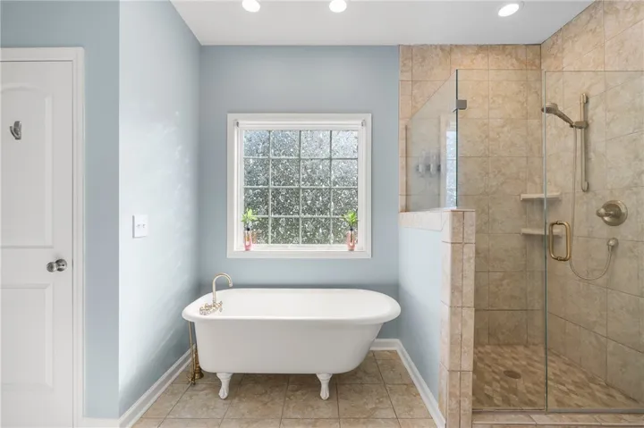 Relax in the classic clawfoot tub or refresh in the spacious walk-in shower.