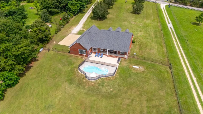 An aerial perspective reveals a private pool with ample patio space, perfect for outdoor leisure.
