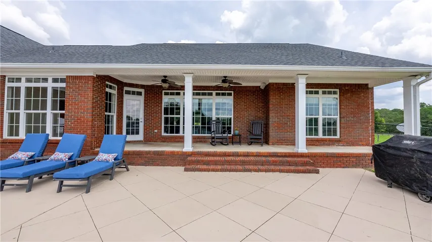 Brick exterior offers a spacious covered patio, perfect for outdoor entertaining.