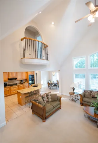 Voluminous vaulted ceilings elevate this open-concept great room, perfect for entertaining.