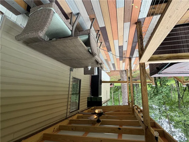 A spacious, multi-level deck offers serene views and ample outdoor living space.