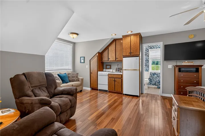 A clever kitchen solution integrates seamlessly into this functional, compact living space with lustrous hardwood flooring.