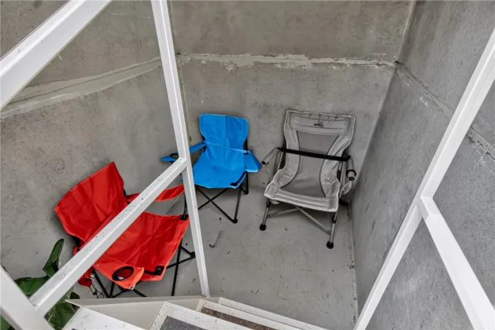 A well-lit, unfinished basement area with concrete walls and flooring, ideal for storage or future development.