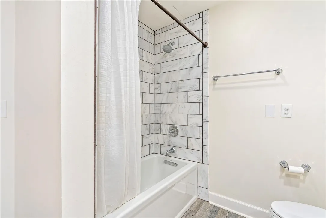 A pristine bath featuring elegant subway tile and modern fixtures offers a refreshing retreat.