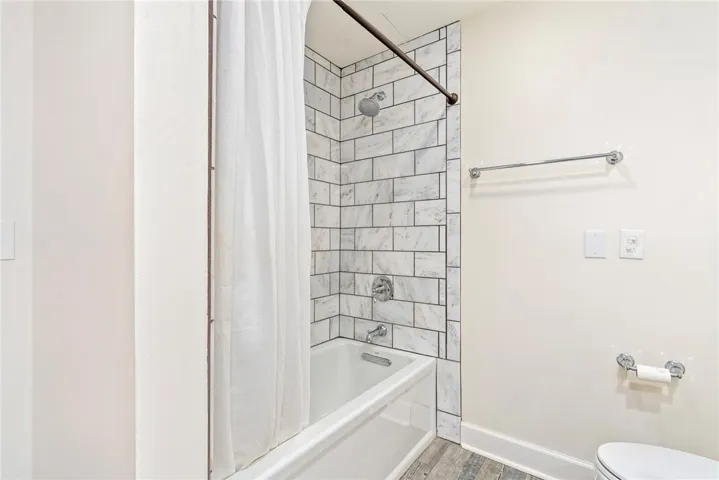 A pristine bath featuring elegant subway tile and modern fixtures offers a refreshing retreat.