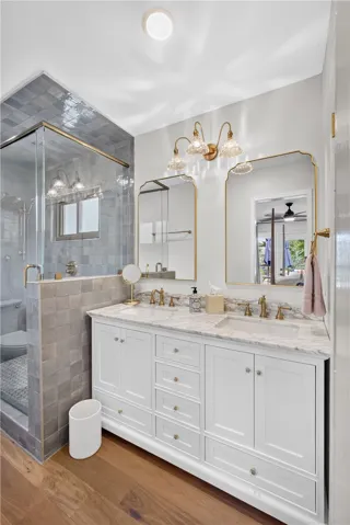 beautiful countertops adorn the spacious double vanity, complementing the flooring.