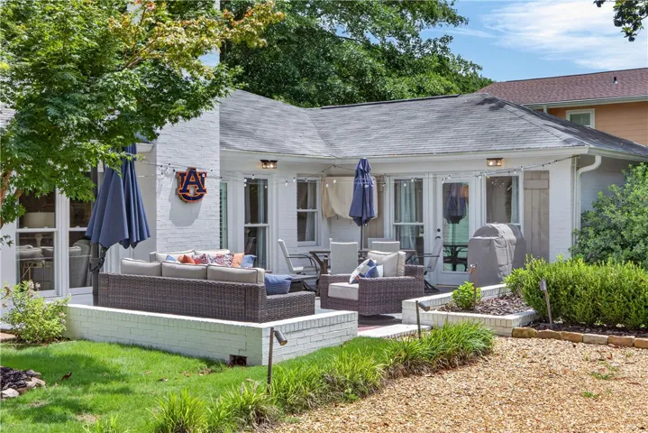 A private outdoor patio with string lights offers a tranquil space for gatherings.