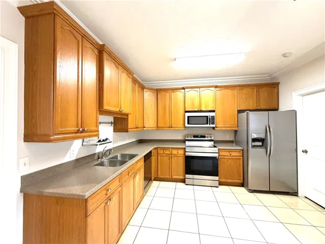 A well-equipped culinary space featuring abundant cabinetry and sleek stainless steel appliances.