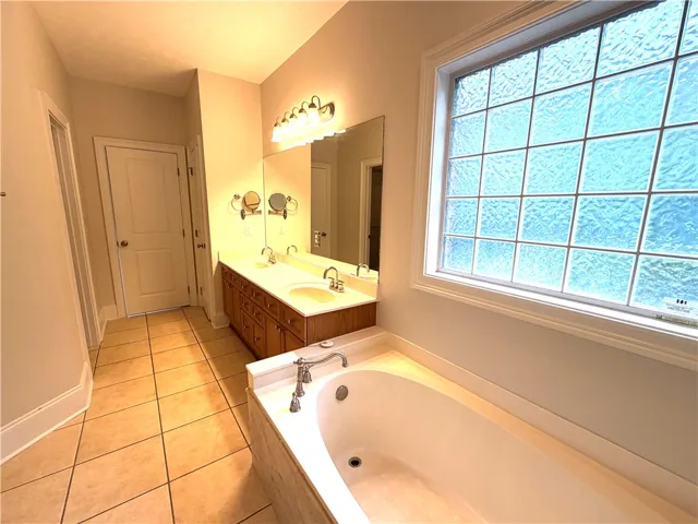 Double vanity and a deep soaking tub create a restful bathroom​​‌​​​​‌​​‌‌​‌‌​​​‌‌​‌​‌​‌​​​‌​​ retreat.