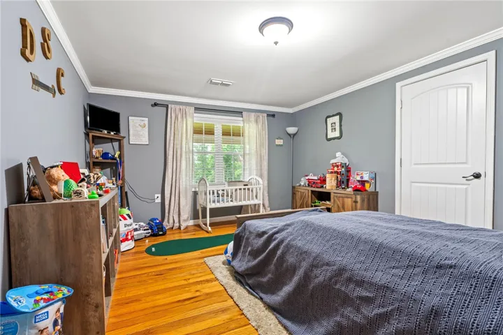 Hardwood floors and generous natural light create an inviting atmosphere.