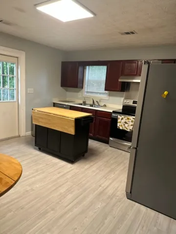 A functional kitchen provides ample space for culinary endeavors and daily living.