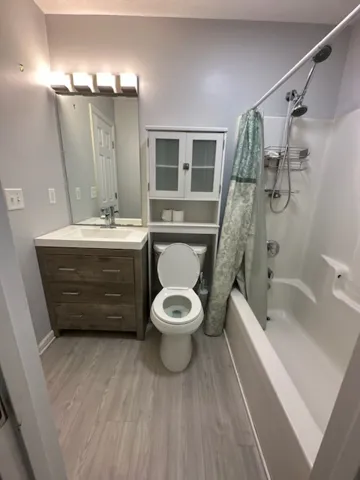 A well-appointed bath boasts ample storage and modern fixtures, creating a refreshed atmosphere.