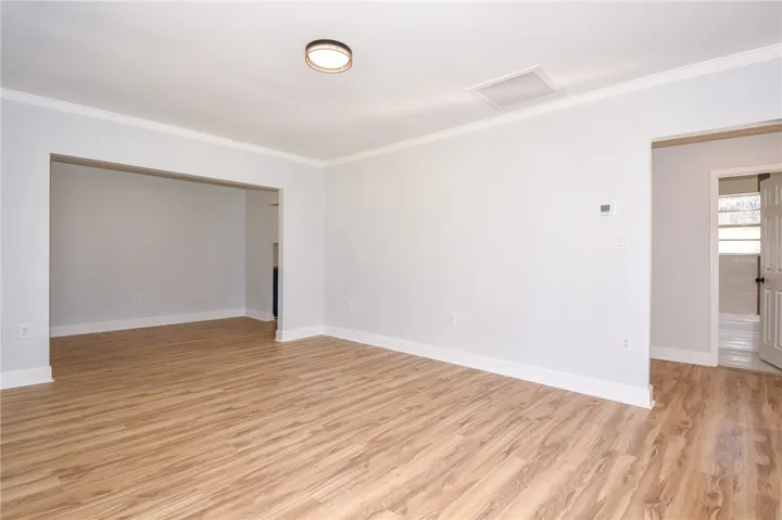 Streamlined living space offers durable flooring and an inviting open concept.