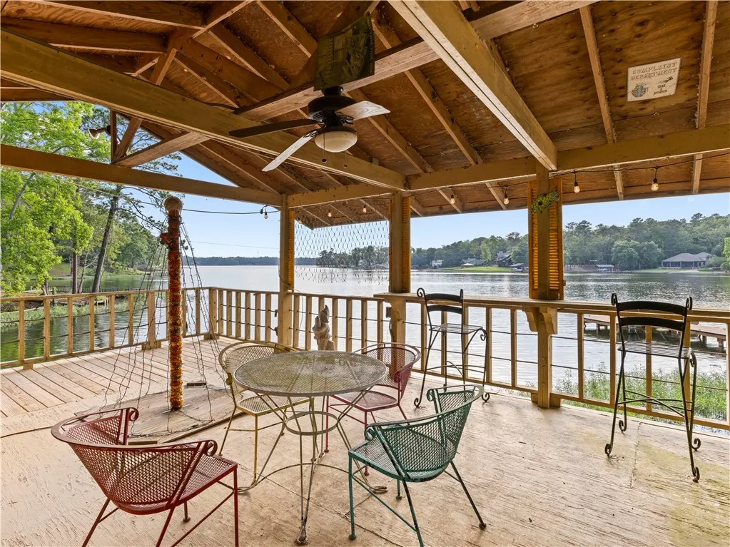 Relax in this tranquil covered patio, offering exceptional water views from the comfort of your own outdoor retreat.