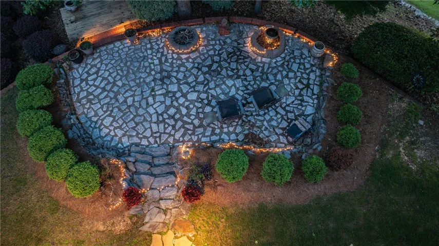 A flagstone patio featuring two inviting fire pits, perfect for evening gatherings.
