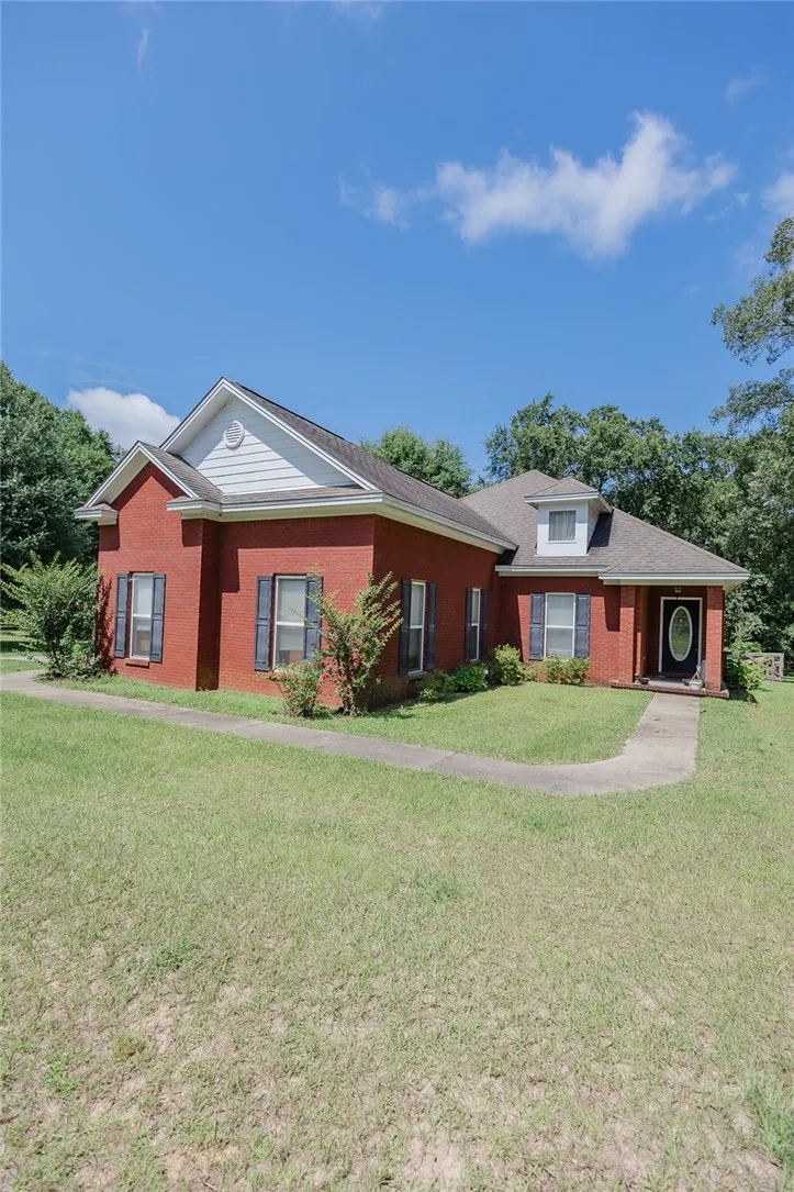 A classic brick exterior offers enduring charm and low-maintenance appeal.