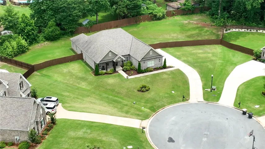 A cul-de-sac residence with a manicured lawn offers privacy and convenient access to neighborhood amenities.