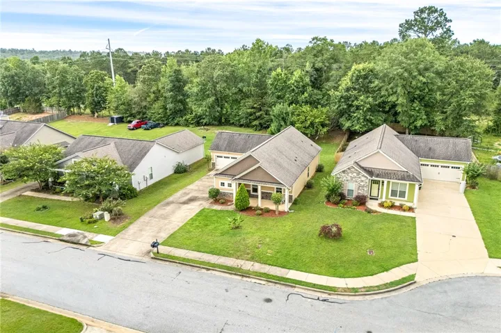 Lush landscaping defines the curb appeal of this charming cul-de-sac residence.