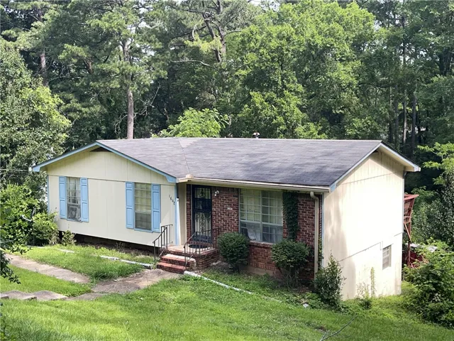 A classic brick and siding home with a welcoming front entrance offers a comfortable suburban retreat.